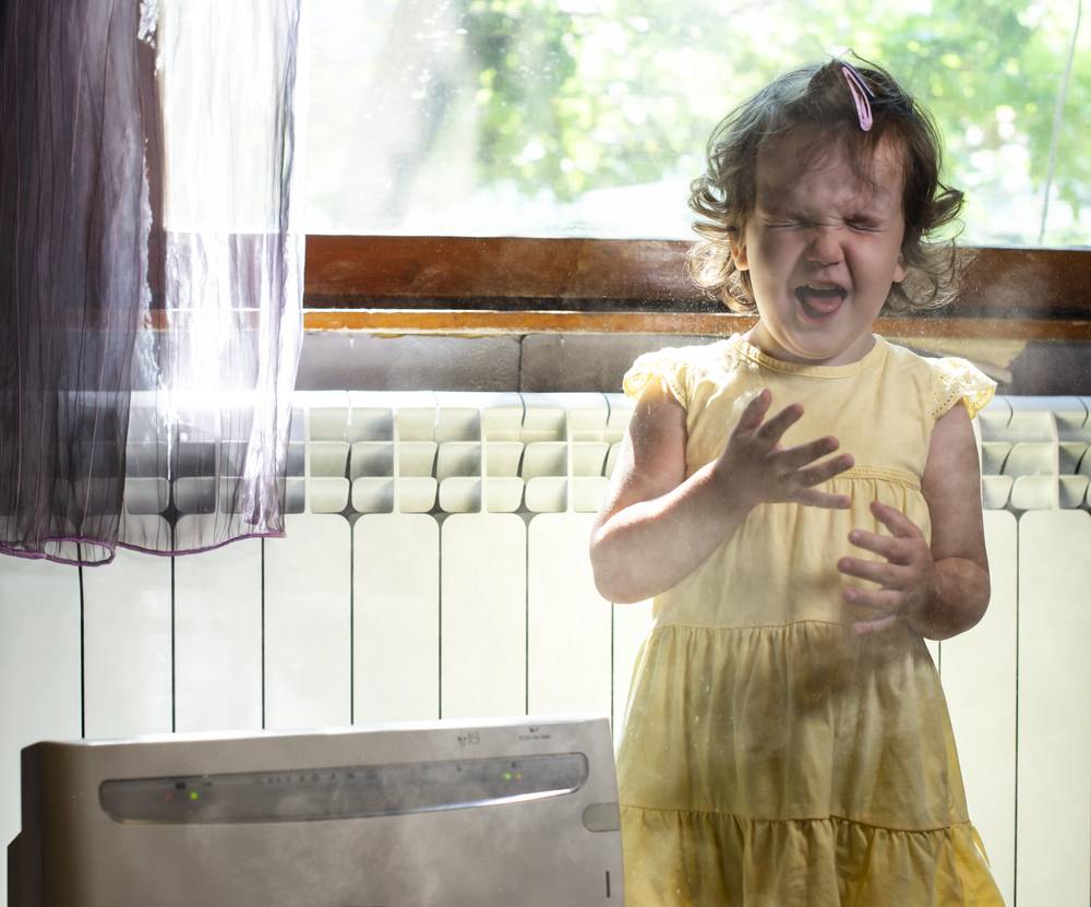 child in dusty room