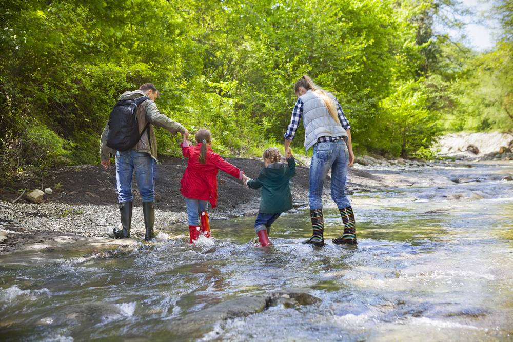 family in the rain Does April showers bring mold?